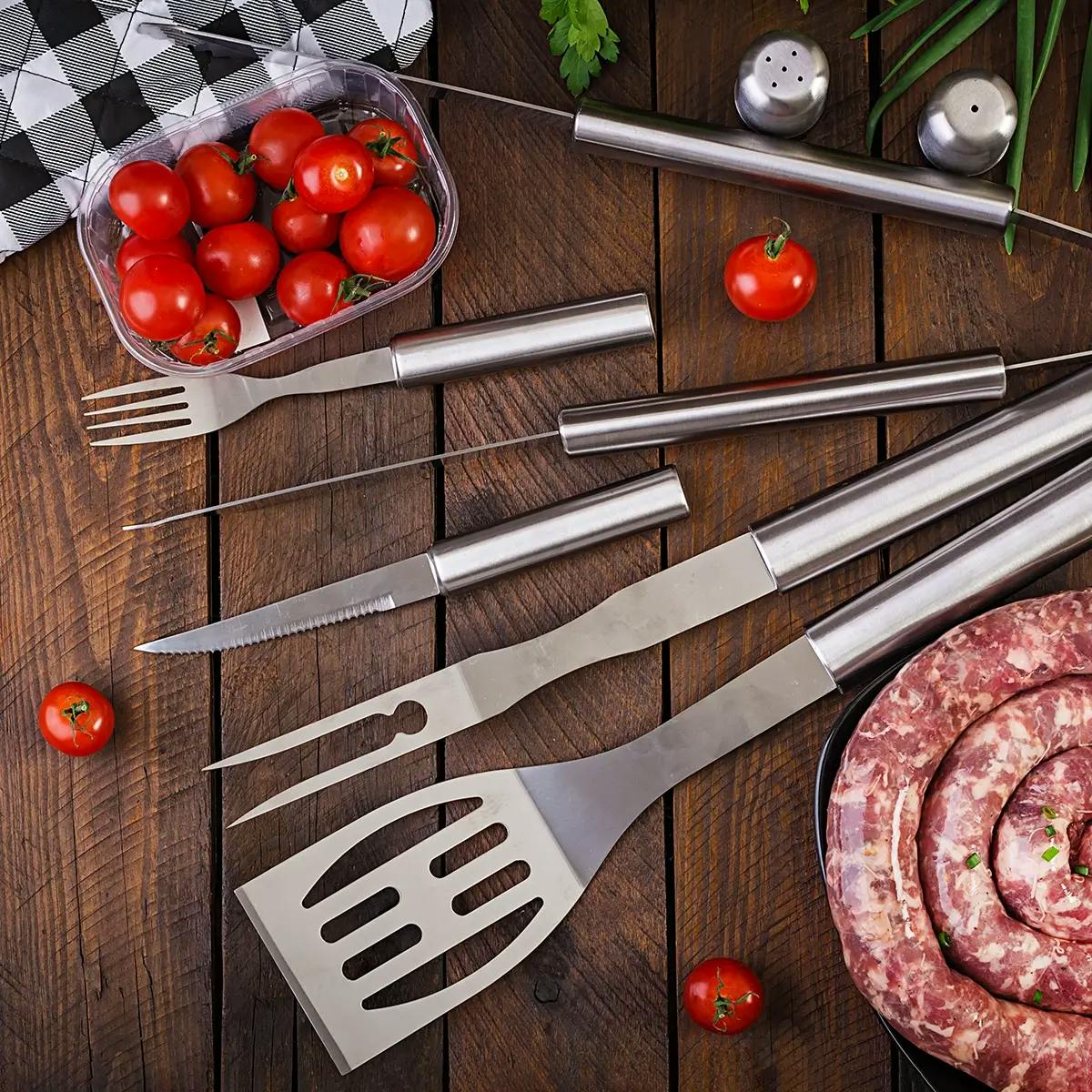 Tools for making grilled food in a backyard barbecue.