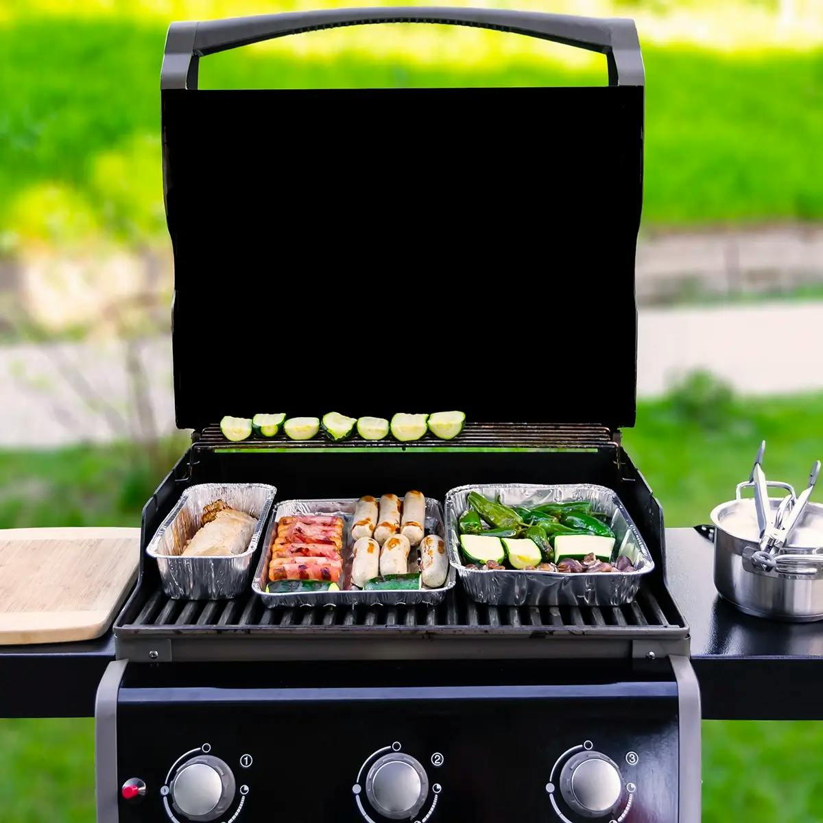 Gas grill in a backyard barbecue.