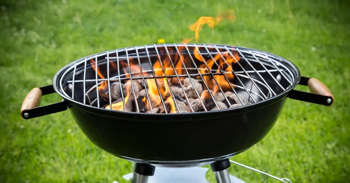 Charcoal grill in a backyard barbecue.