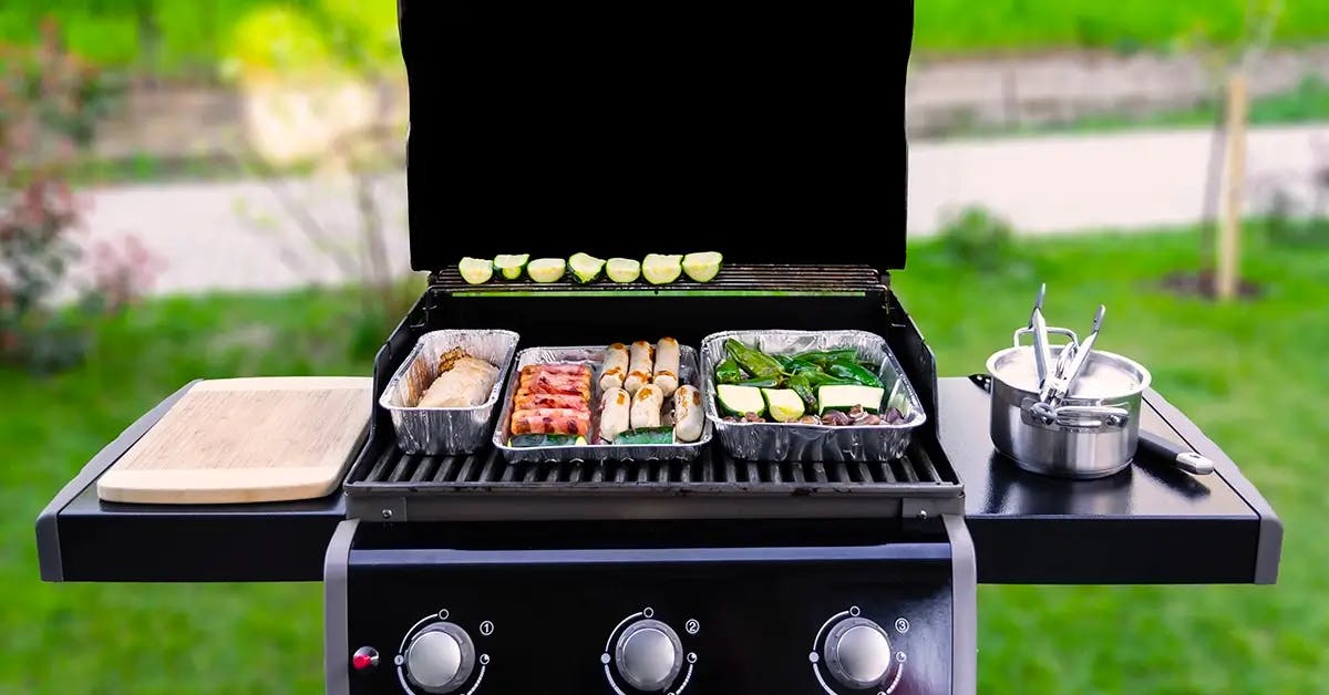 Gas grill in a backyard barbecue.